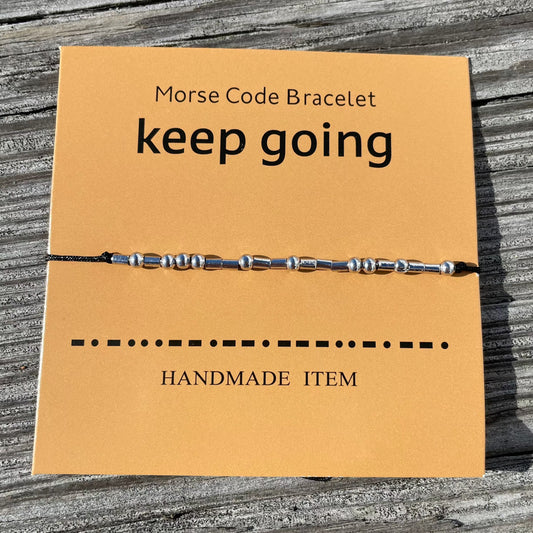 Keep Going morse code bracelet on card stock backing