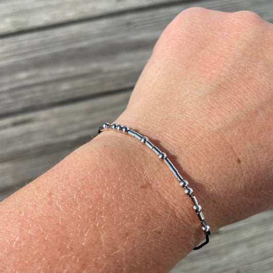 View of keep going morse code bracelet on a wrist